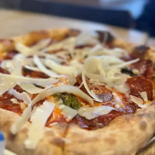 a pizza with cheese and pepperoni