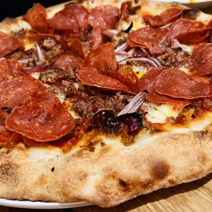 Pepperoni pizza ($25) with added sausage (+$4)