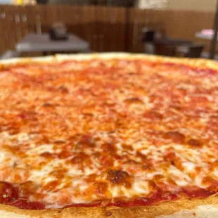 a cheese pizza on a table