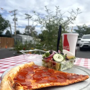 a slice of pepperoni pizza on a plate