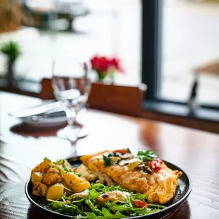 Scrambled eggs with potatoes and salad.