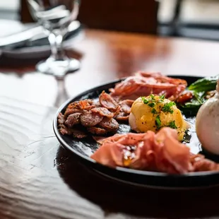 Poached egg benedict, with buffola cheese, Prosciutto crudo and cotto and sicillian sausage!