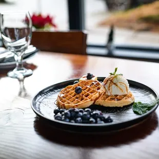 House made waffles, with icecream and fresh blueberries.