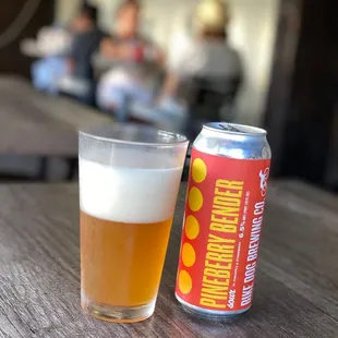 a beer and a can on a table