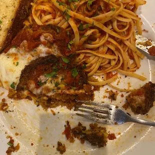 Half eaten eggplant parmigiana. Once they warmed it back up after serving barely warm, it was fine. Ugh!