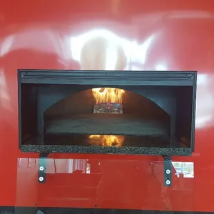 Our Fire Brick Oven hand built on the premises with stones imported from Italy