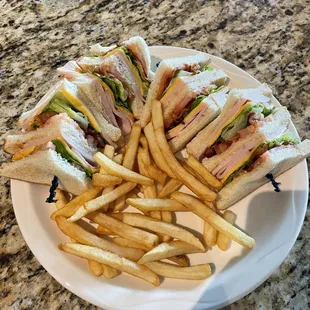 Turkey club sandwich with french fries