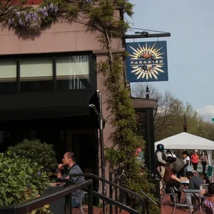 people sitting outside a restaurant