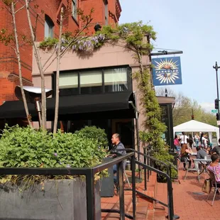 people sitting at tables outside