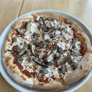 12 inch mushroom pork sausage and jerk chicken pizza