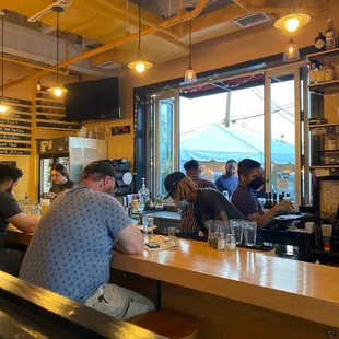 people sitting at the bar