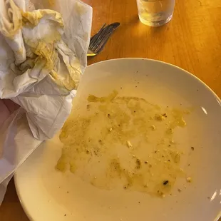 Excess grease and oil from the pizza.