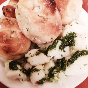 Complimentary garlic knots and Pesto potato salad. Do NOT miss a taste of their namesake!