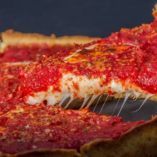 a slice of deep dish pizza
