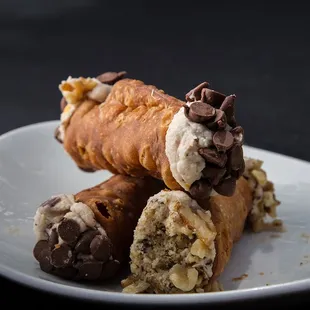 a chocolate covered pastry on a plate
