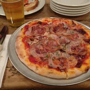 Rustic pizza (pancetta, prosciutto, &amp; radicchio) and a pint of spotted cow to put it down.