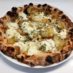 10/22/22 Patate - Yukon Gold Potato, Shaved Garlic, Shallot Cream, Provolone, Pecorino Romano,  Parmigiano Reggiano, Oregano, Thyme