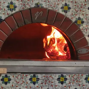 a fire in a brick oven