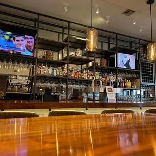 a bar with a large screen tv