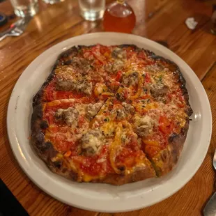 Sweet fennel sausage, roasted peppers, &amp; provolone red sauce pizza