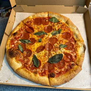 Fresh basil and the sauce is amazing!  Perfect crust!