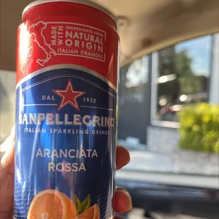 a person holding a can