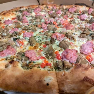 Italian Sausage &amp; Eggplant Chutney Pizza. $35. Pickled onions, roasted peppers, garlic puree, mint-marinated feta cheese, mozzarella.