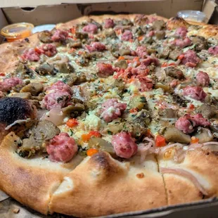 Italian Sausage &amp; Eggplant Chutney Pizza. $35. Pickled onions, roasted peppers, garlic puree, mint-marinated feta cheese, mozzarella.