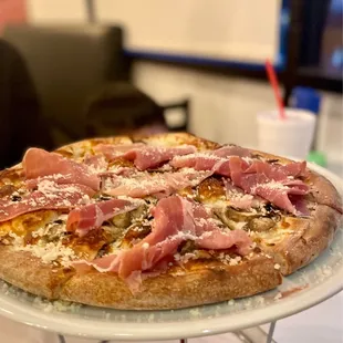 Garibaldi pizza with prosciutto, mushrooms and cheese. $19.