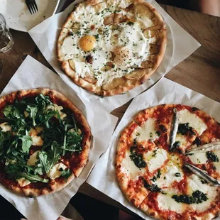 San Marzano Tomato Sauce, Mascarpone, Wild Arugula.  Tomato, Mozzarella, Basil with White Anchovies. Farm Egg, Mustard, Gruyere, Chive