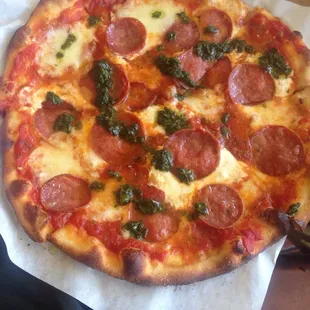 Tomatoes, mozzarella, basil, and pepperoni pizza. $13.50