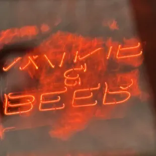 Wine &amp; beer sign reflected in the window