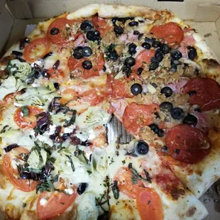 Large half meat and half puttanesca (already took 1 bite before taking picture)