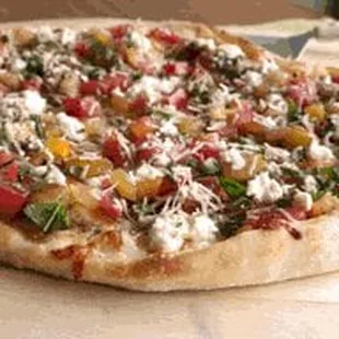 Pizza Fresca - Heirloom tomatoes, Fresh Mozzella, Basil, Drizzled with Balsamic Viniagrette and Olive Oil.