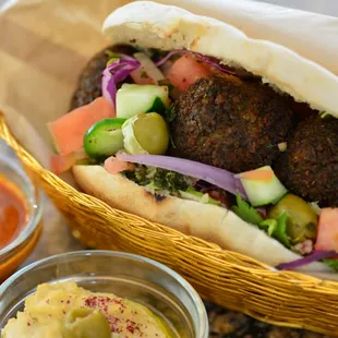 Fresh baked pita stuffed with yummy falafel and toppings