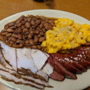 Two meat plate with turkey and sausage plus macaronni and beans