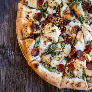 a pizza on a wooden table