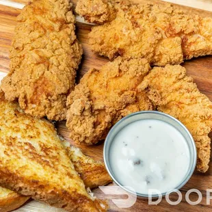 Chicken tender basket (available toasted in wing sauce ) served with Texas toast and fries and gravy