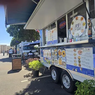 Last truck from entrance of parking lot behind coach store