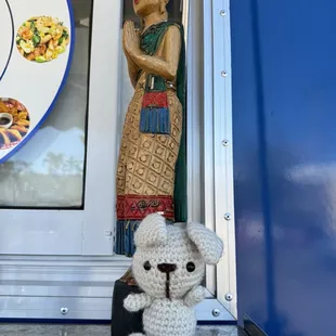 a stuffed dog and a plate of food