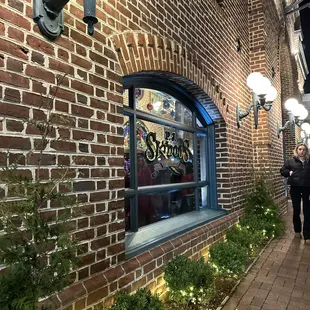 two people walking down the sidewalk