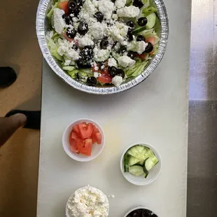 greek salad, cucumbers, tomatoes, olives, and feta cheese