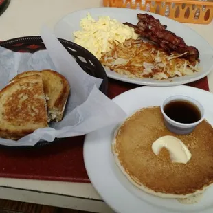 Breakfast and lunch from open to close here's a Reuben sandwich and a 3egg combo. Bacon scrambled eggs hash browns and pancake