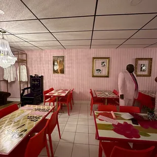 a man in a white suit and tie