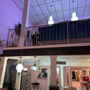 two people standing on a balcony