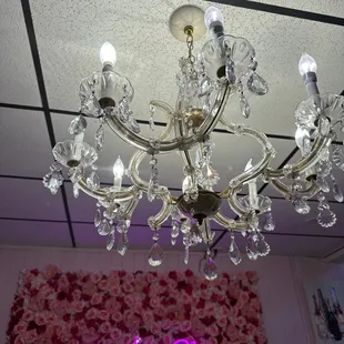a chandelier with pink flowers