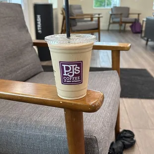 a cup of coffee on a chair