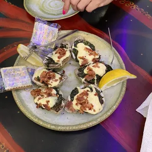 Rockefeller oysters, served cooked and dressed.