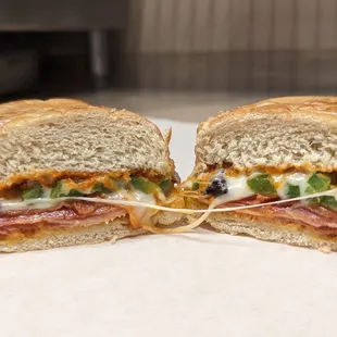 Italian Sub: Salami, Pepperoni, Canadian Ham, Housemade Marinara, Mozzarella, Moroccan Dried Cured Black Olives, Bell Pepper