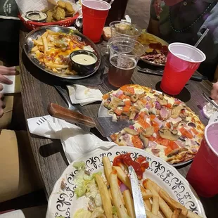 Tuscany pizza, loaded French fries, fried pickles